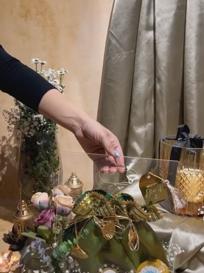 The acrylic bag hamper in its festive setting. It’s a modern and chic way to present a traditional Diwali gift.