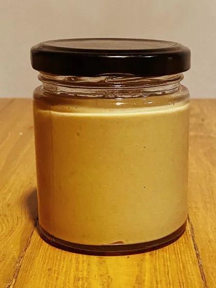 This is what pure, dog-friendly peanut butter looks like. We make our own 100% natural peanut butter with just one ingredient: peanuts. There's no added salt, sugar, or junk, just nutty goodness.