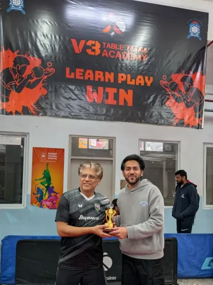 The runner-up of the Men's Singles event receiving his trophy. The corporate tournament saw participation from 50 players, making for a highly competitive field.