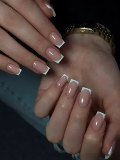 A timeless classic, these long, square-shaped acrylic extensions feature a perfectly crisp and clean French manicure, showing the precision of our work.
