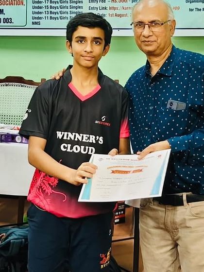Shubham Trivedi receiving his certificate for his maiden Under 17 Boys singles title at the Karnataka state ranking tournament.
