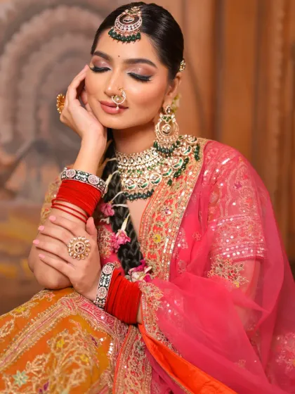 A soft and dreamy pose that showcases the beautiful blend of colors in her eye makeup and the gentle glow on her skin. It's a moment of quiet elegance.