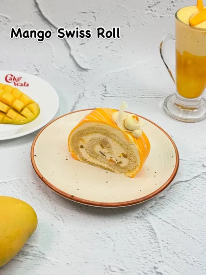 A delightful swirl of fun, our Mango Swiss Roll is a fluffy sponge cake rolled with a creamy mango filling. It's a light and elegant treat that captures the essence of summer.