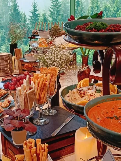 A little bit of everything, because why not? This abundant spread against a beautiful forest backdrop is what foodie dreams are made of.