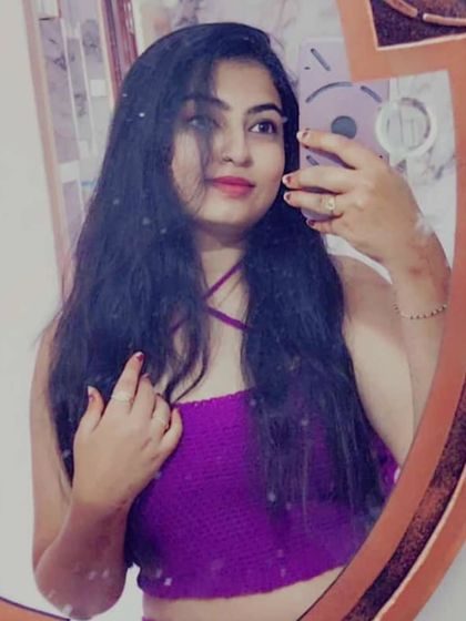 A client looking fabulous in her purple crochet halter top. It's always a joy to see my creations being worn and loved.