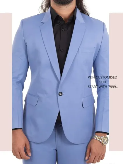 A close-up of the sky blue suit jacket, highlighting its classic lapel and single-button closure.