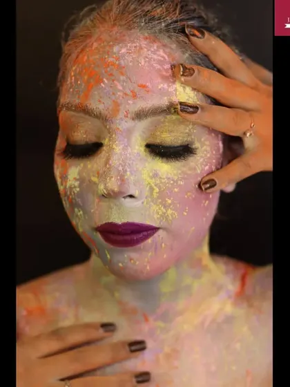 A close-up of the Holi makeup, showing the texture and blend of colors on the skin.
