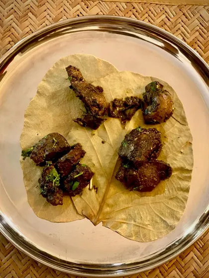A platter of my Bannur lamb organ fry, showcasing different textures and preparations. This is a true delicacy for the adventurous eater.