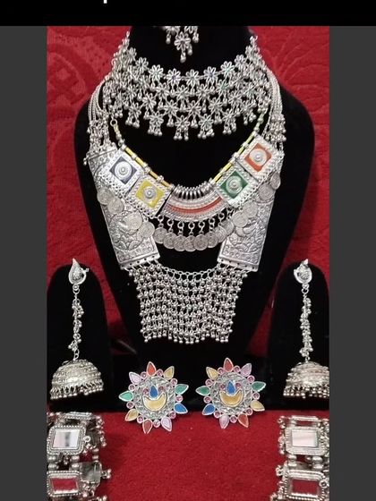 A complete oxidised silver set for Navratri, including a choker, long necklace, earrings, and bracelets.