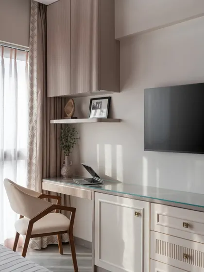 Another view of the integrated study and TV unit. The fluted detailing and soft neutrals create a cohesive look, proving that functional design can be beautiful.