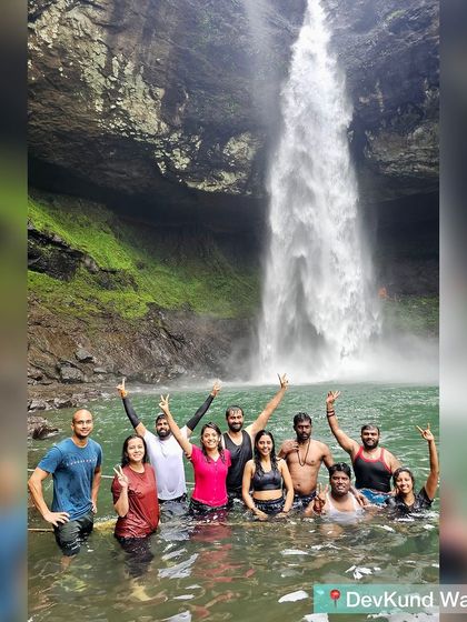 The full trekking batch posing for a victory shot in the emerald waters of Devkund waterfall.