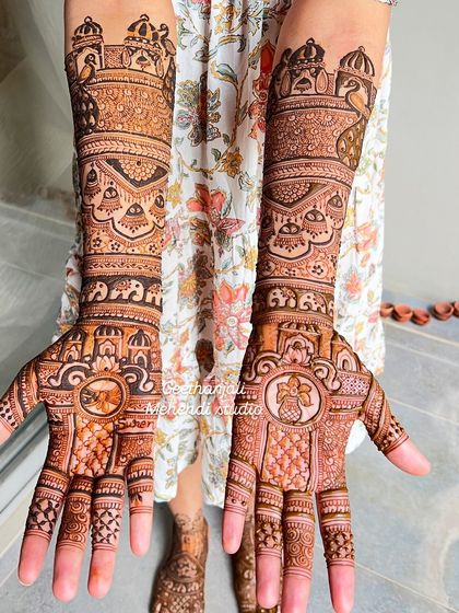 Royal heritage woven into every line. This bridal design is rich with Indian cultural motifs, including palaces, elephants, and a traditional doli.