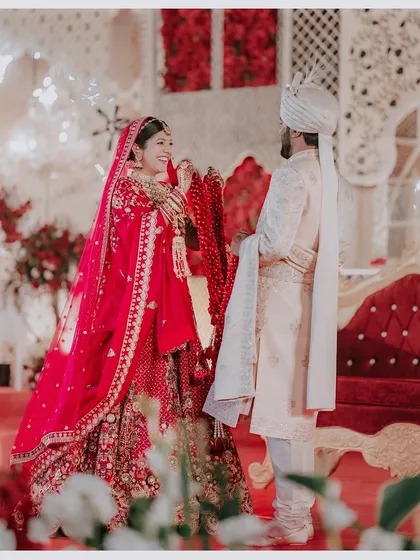 The Varmala is full of unscripted glances and happy tears. Capturing Khyati's beautiful, candid smile as she looks at Sourav is what my work is all about. It’s these real, in-between moments that become the most priceless treasures.