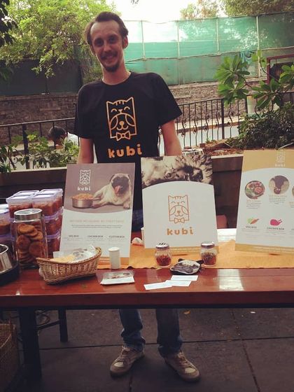 Here I am at a local Pupper Party event, ready to serve fresh KuBi meals. I love meeting new dogs and their parents and sharing my passion for healthy pet food with the community.