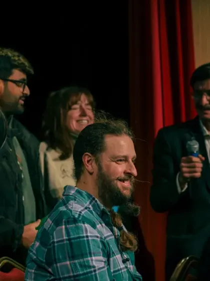 The smiles and laughter from the volunteers on stage are the best reward. This was a fun moment during the balloon-guessing part of my blindfold act.