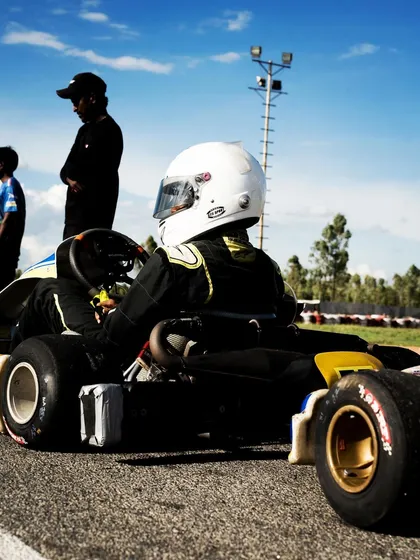 A driver waits on the grid, ready for the race to begin.