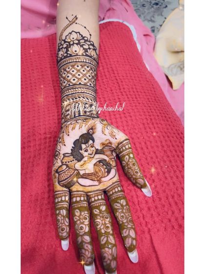 A close-up of the baby Krishna portrait from a baby shower design, showing the fine details of the flute and the butter pot.