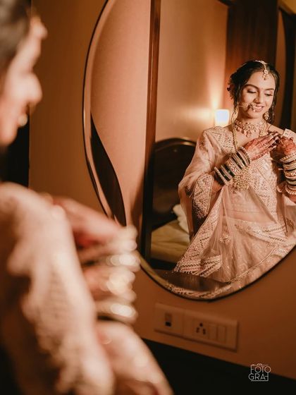 A candid moment of the bride getting ready. The focus is on creating a look that feels personal and authentic to her style.