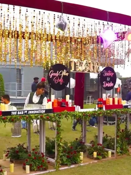 A custom outdoor bar setup designed for a corporate event. We incorporated branded signage, decorative elements like candles and foliage, and a functional layout to create a stylish and engaging focal point for guests to network and enjoy themselves.