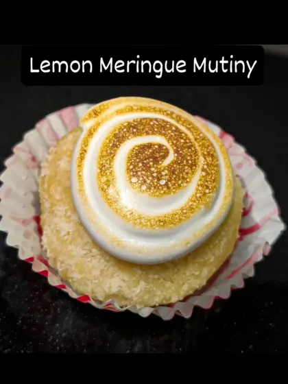 This is my Lemon Meringue Bombolini, a little burst of sunshine. It's a soft, baked doughnut filled with tangy lemon curd and topped with a swirl of fluffy, torched meringue for that classic toasted flavour.