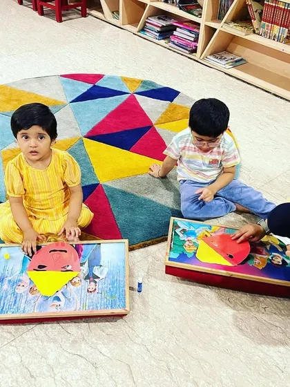 An instructor helps the children with their Ravana mask craft during our Dussehra event. We always ensure there's plenty of guidance and encouragement for every child.