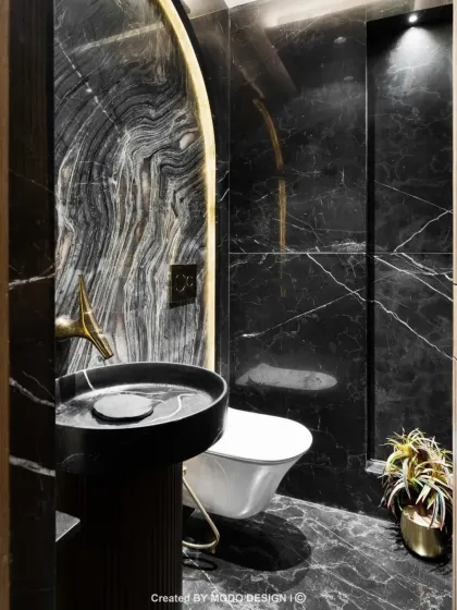 Bold, modern, and effortlessly chic. This black marble bathroom proves that dark interiors can be just as inviting and luxurious, creating a powerful statement in a personal space.