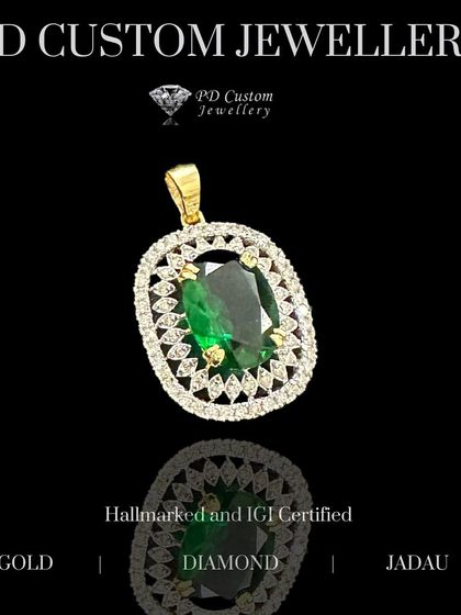 An exquisite emerald and diamond pendant. The vibrant green of the central emerald is beautifully contrasted by a double halo of brilliant diamonds. A perfect gift for Karva Chauth.