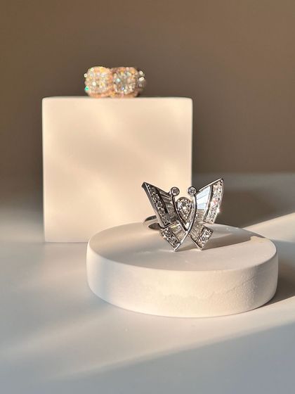 A closer look at the delicate yet striking diamond butterfly ring. The mix of baguette and round diamonds gives it a unique sparkle.