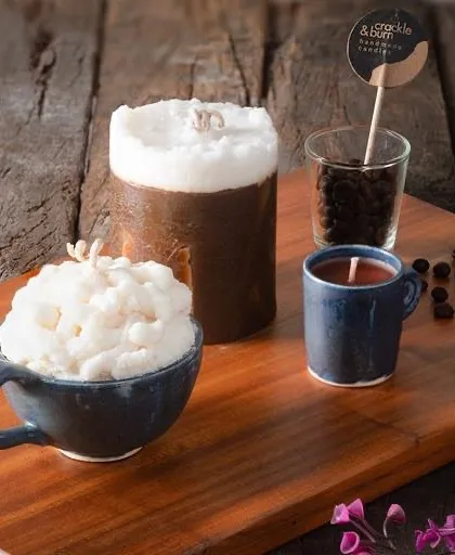 A custom order for a coffee lover! This set includes a cappuccino-style candle, a coffee cup candle, and a pillar candle with a rich coffee scent.