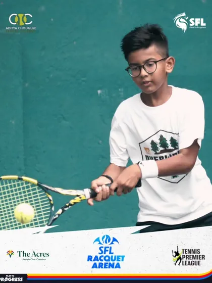 A young player with glasses shows intense concentration as he prepares to return a shot. We welcome kids of all backgrounds to learn and grow with us.