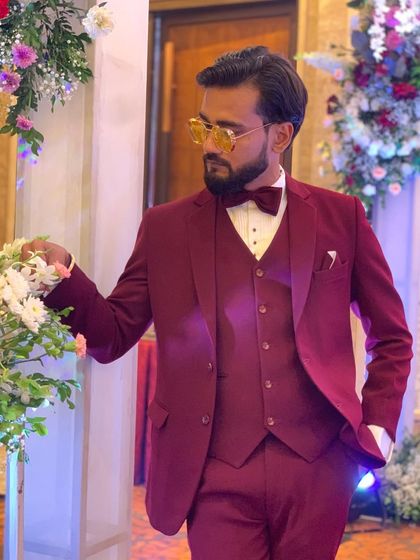 A moment of quiet before the show begins. The suit, the flowers, the stage, it's all part of the performance.