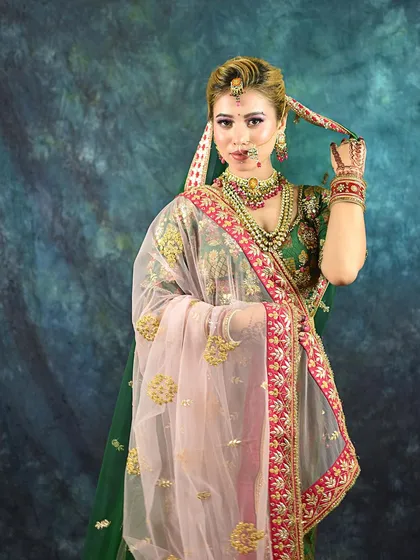 A playful pose that adds a touch of personality to the traditional bridal shoot.