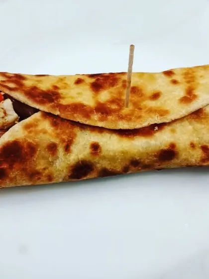 Who says healthy food can't be delicious? This is a healthy tortilla wrap, packed with colorful veggies and lean protein. It's a perfect example of a balanced, tasty, and quick meal that you can easily make at home.