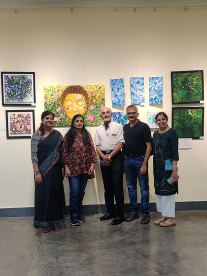 A group photo with visitors and fellow artists at the exhibition.