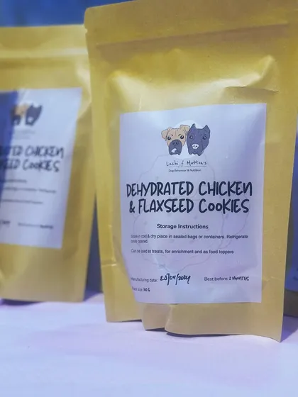 Our Dehydrated Chicken & Flaxseed Cookies, ready to go. Each pouch is packed with protein and healthy fats, featuring our clear labeling so you know exactly what you're feeding your best friend.