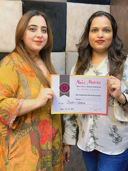 Our founder presenting a certificate to Swati Verma. Each certificate represents a new professional ready to make their mark in the beauty industry.
