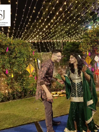 The joy of a Mehandi night is infectious. Here, the couple dances under a canopy of fairy lights in a garden setting I decorated with traditional kites and tassels.