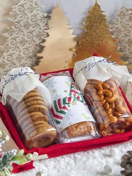 A variation of my Christmas gift tray, featuring a festive bar cake alongside crunchy cookies and savory cashews. It's a delightful mix of sweet and savory to celebrate the holidays.
