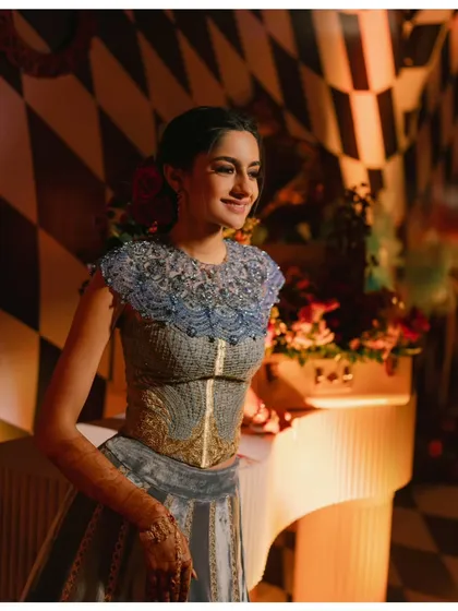 A beautiful portrait of the bride by a vintage-style piano, part of the eclectic and whimsical decor. I source unique props to bring my themes to life.