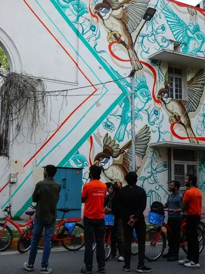 This mural featuring sparrows is a commentary on the loss of biodiversity in urban spaces. Our tours often spark interesting conversations about art and the environment.