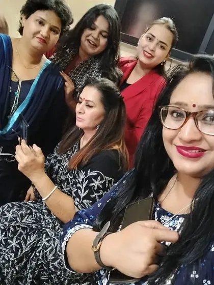 A candid moment with fellow female advocates during a meeting. It highlights the camaraderie and supportive network of women in the legal profession.