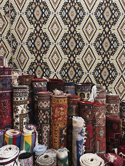 The rich patterns and textures of traditional Azerbaijani carpets in Baku. These visuals are a huge source of inspiration for set design and styling.