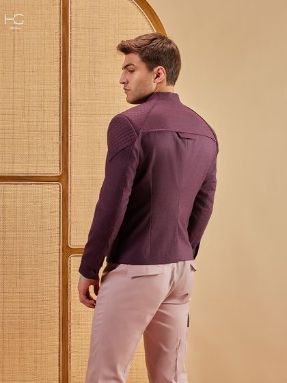 The back view of the maroon shacket, showcasing the quilted shoulder panels and tailored fit that give it a modern, structured look.