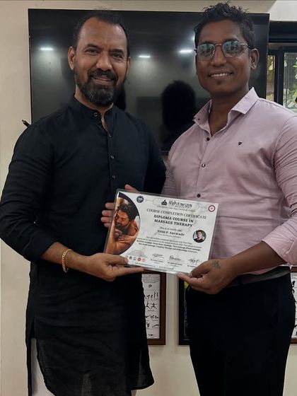 Another student proudly receives his certificate for the Diploma in Massage Therapy. It is always rewarding to see our students achieve their goals.