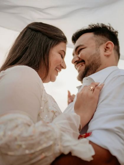 A beautiful, smiling portrait of the couple, showcasing their genuine happiness and connection.