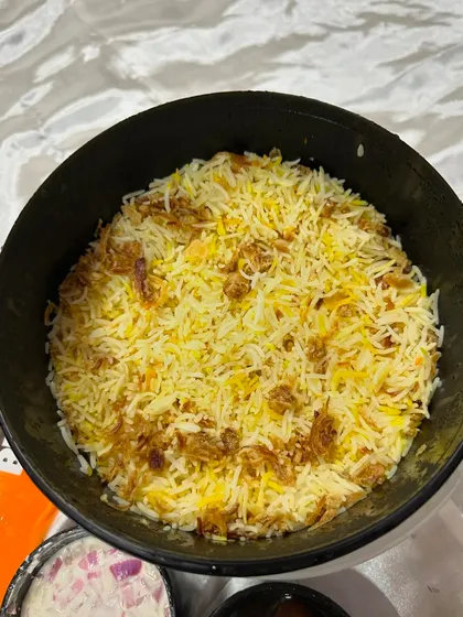 A full bucket of our signature biryani, ready to be enjoyed. We use long-grain basmati rice and the freshest ingredients to give you the best taste.