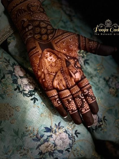 The beautiful bride, Radha Rani, is intricately detailed on the palm, a perfect design for a bride who wants a spiritual and artistic touch.