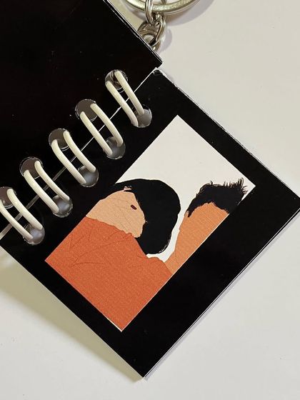 An intimate faceless portrait inside a custom keychain.