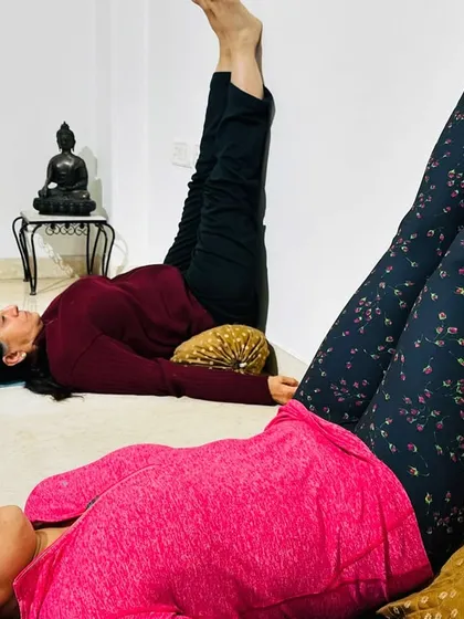 Restorative yoga is a key part of our practice. Here, students use the wall and cushions for Viparita Karani, or Legs Up the Wall Pose. This gentle inversion is incredibly calming for the nervous system and helps relieve tired legs and feet.