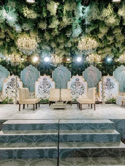 With lush greenery, cascading florals, and twinkling lights, my enchanted forest decor transforms this wedding into a magical wonderland. The stage is set for a fairytale moment, with every detail designed to steal the show.